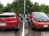 2014 Chevrolet Volt Red and bmw i3 plugged in charging